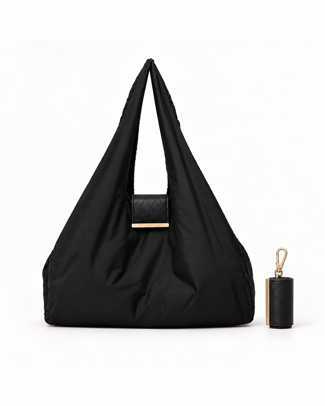 Zwarte NOMO Keychain Tote uitgerold, met de opgerolde keychain ernaast